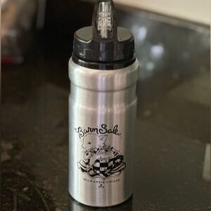 Mackenzie-Childs Barn Sale water bottle with flip up straw top.